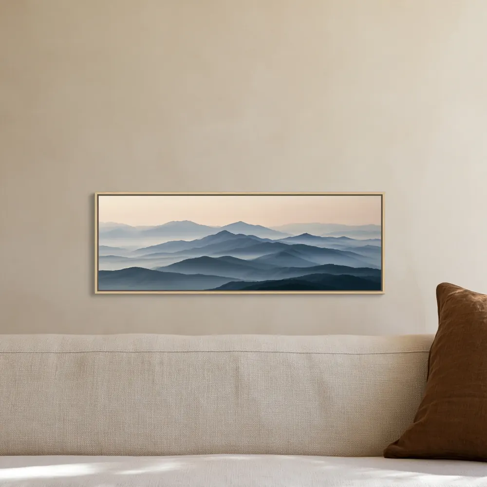 A misty mountain panorama as a floating-frame canvas in the Warm linen sofa