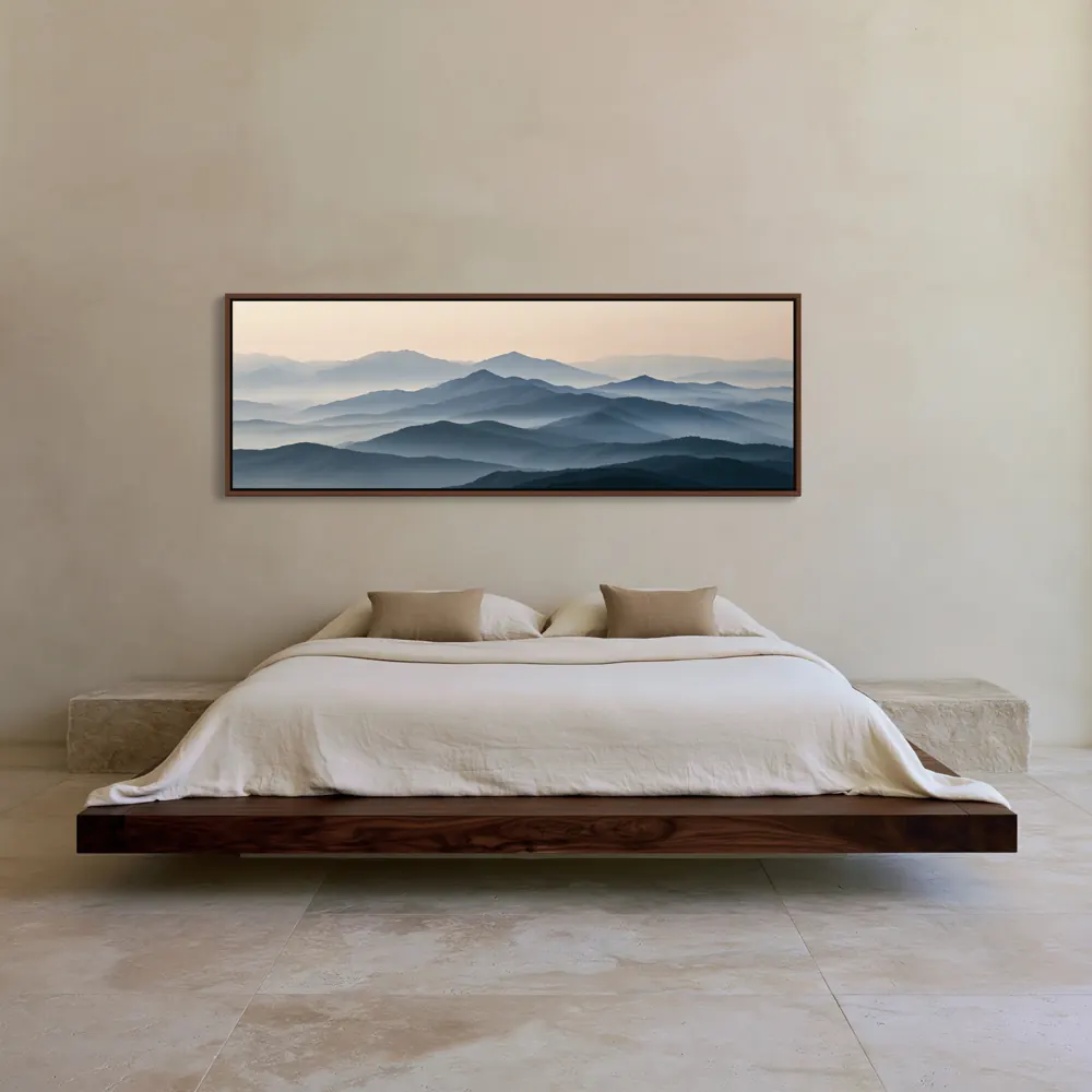 A misty mountain panorama as a floating-frame canvas in the Desert walnut platform bedroom