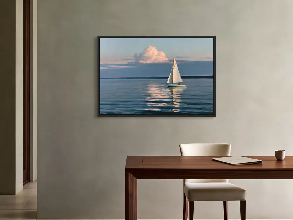 A sailboat-at-dusk oil painting as a black floating-frame canvas in the Architect oak desk