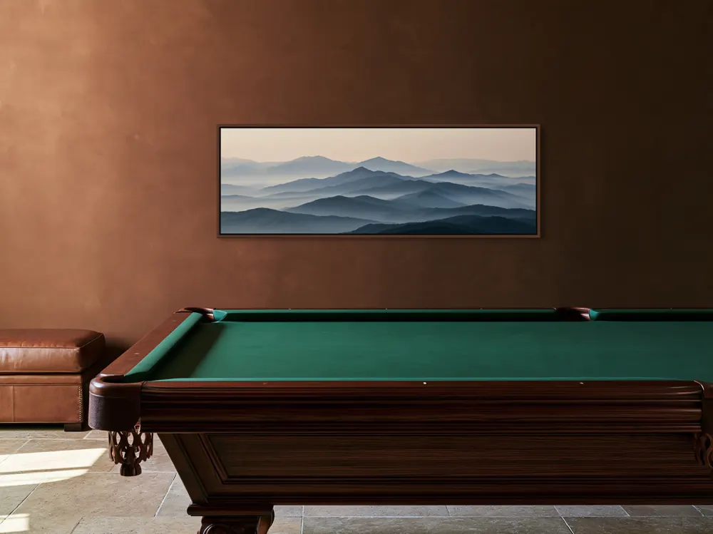 A misty mountain panorama as a walnut floating-frame canvas in the Billiard room