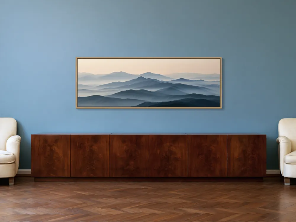 A misty mountain panorama as a natural oak floating-frame canvas in the Blue salon walnut cabinet