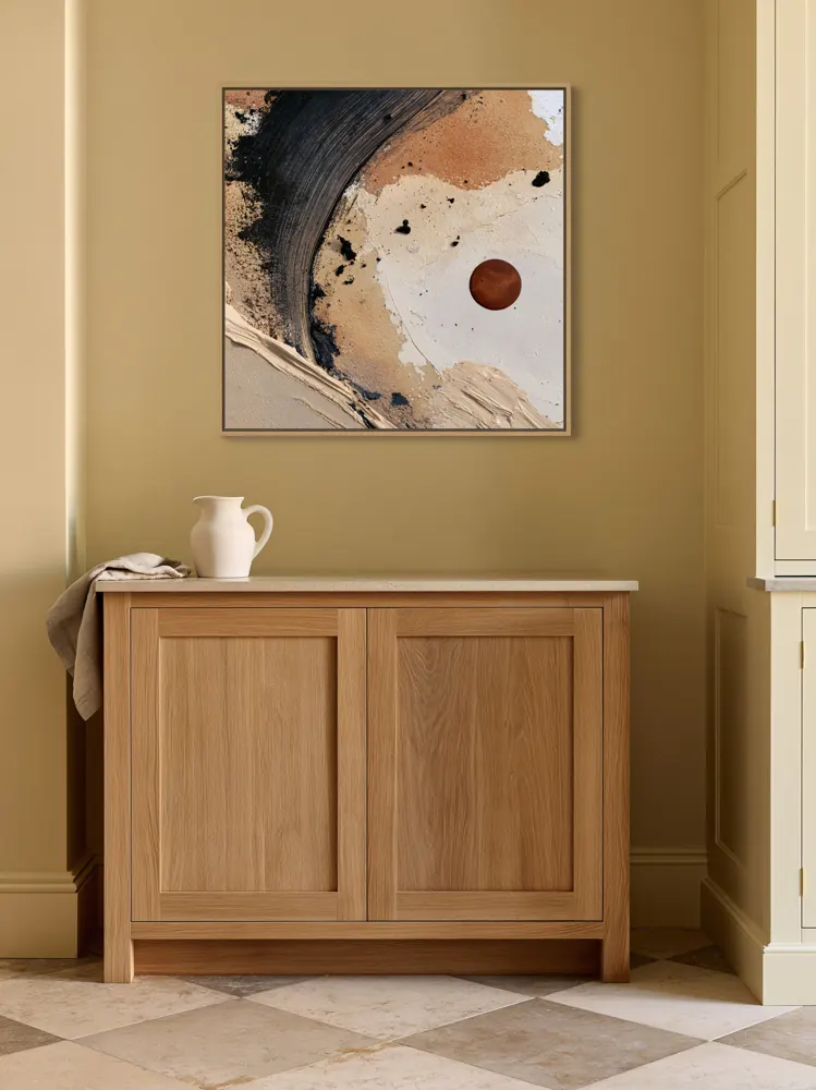 A textured neutral abstract as a natural oak floating-frame canvas in the Butter-yellow kitchen pantry wall