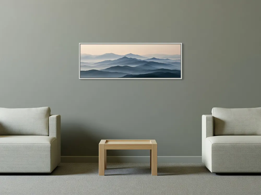 A misty mountain panorama as a white floating-frame canvas in the Calm counselling lounge