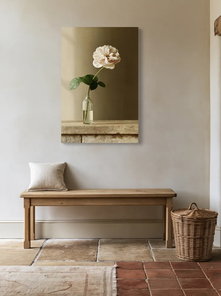 A garden rose still life as a stretched canvas in the Clay entry hall, solid oak bench