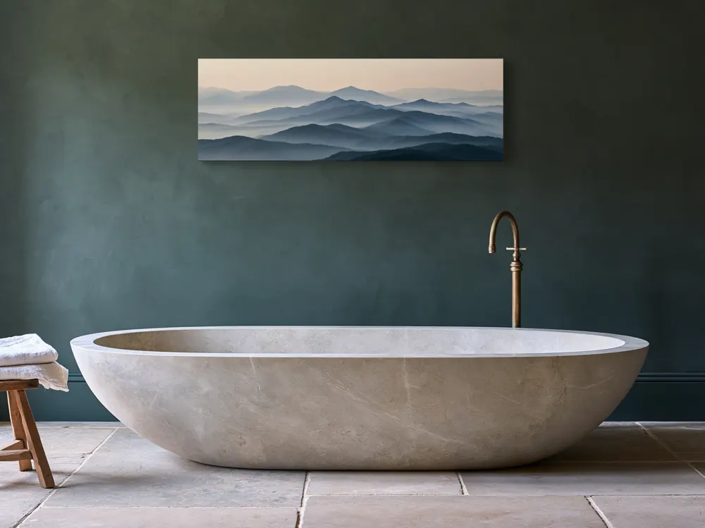 A misty mountain panorama as a stretched canvas in the Green limewash bathroom with stone tub