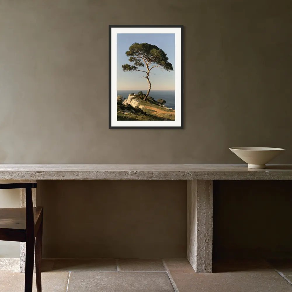 An umbrella pine oil painting as a black framed print with a white mat in the Olive travertine dining console