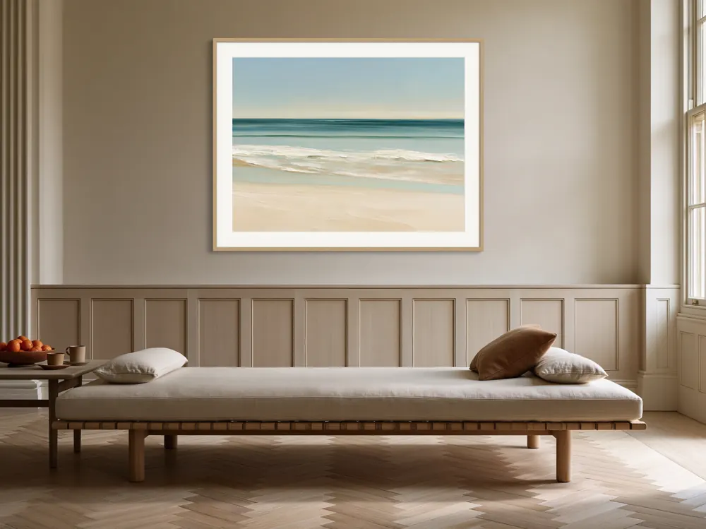 A quiet beach seascape painting as a natural oak framed print with a white mat in the Panelled oak daybed