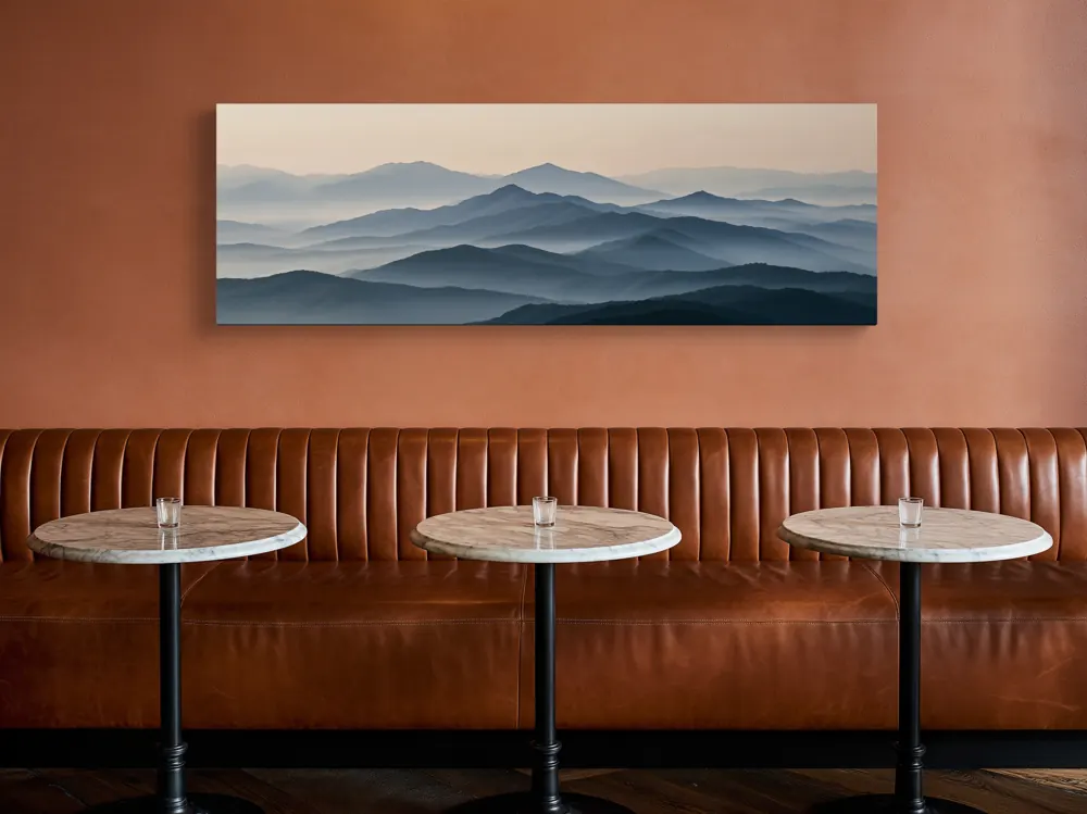 A misty mountain panorama as a stretched canvas in the Restaurant leather banquette