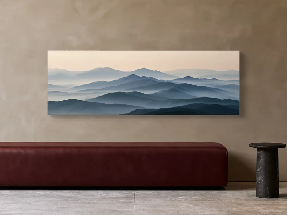 A misty mountain panorama as a stretched canvas in the Sand and burgundy hotel bench