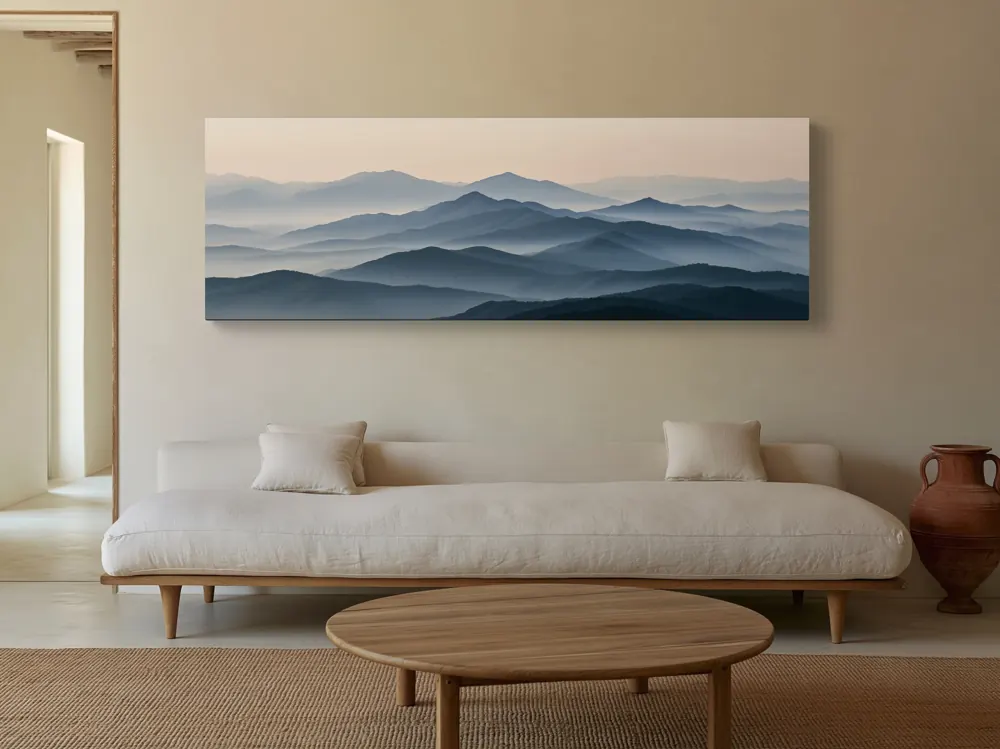 A misty mountain panorama as a stretched canvas in the Sand plaster villa living room