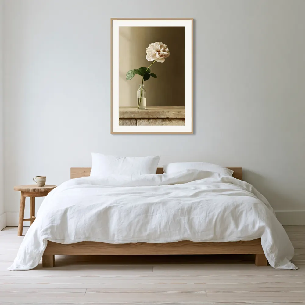 A garden rose still life as a natural oak framed print with a white mat in the Scandinavian bed headboard