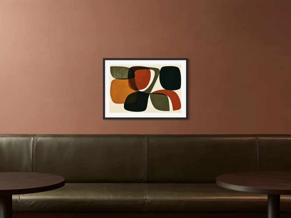 A mid-century abstract as a black framed print with a white mat in the Terracotta olive restaurant booth