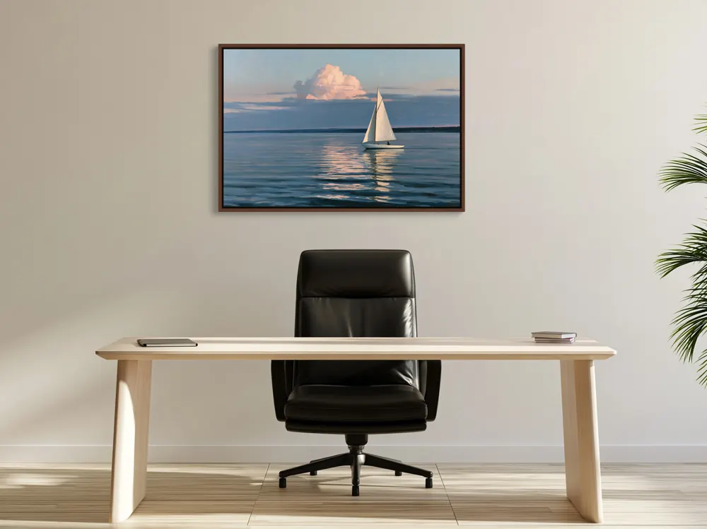 A sailboat-at-dusk oil painting as a walnut floating-frame canvas in the White working office trio